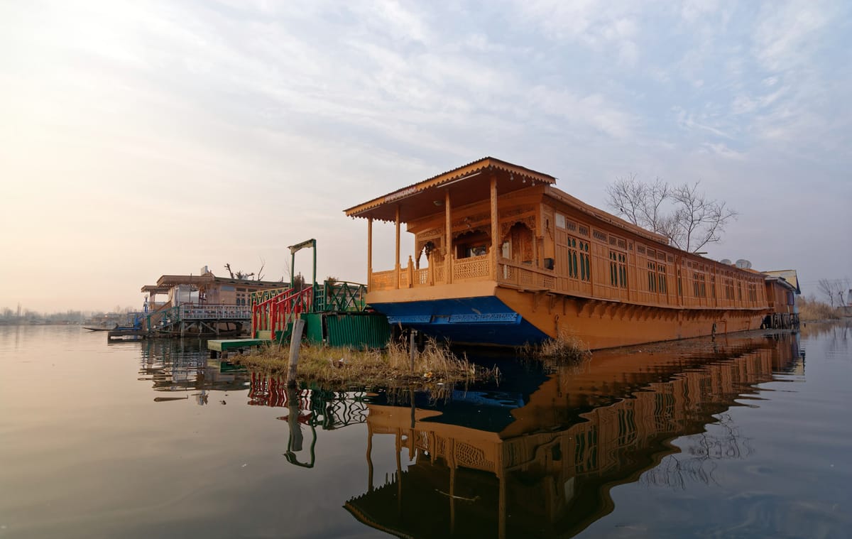 Hand-carved cedar façades lined along the lake