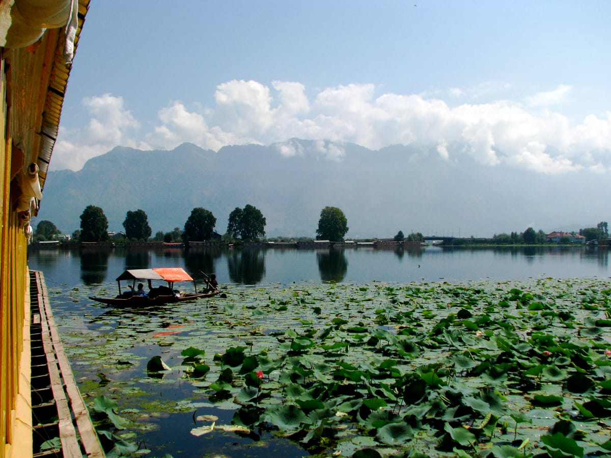 The lake, lotus leaves and mountains — seen from a houseboat