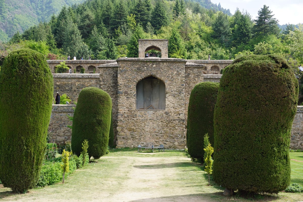 Stone arches and cypress at Pari Mahal